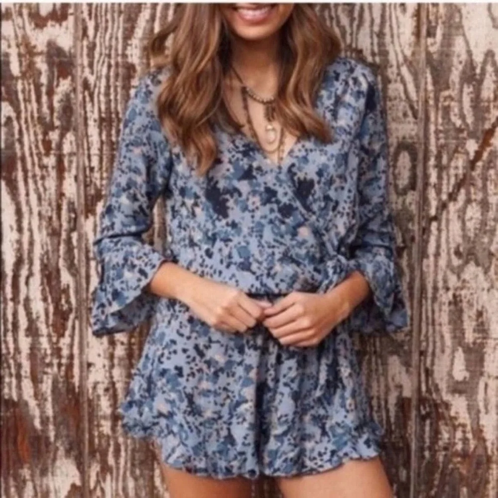 FREE PEOPLE “all the right ruffles” romper